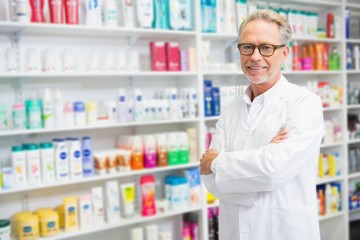 Handsome pharmacist smiling at camera
