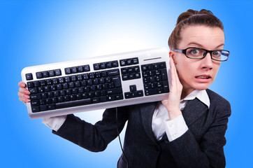 Nerd businessman with computer keyboard on white