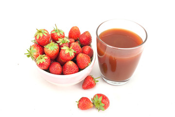 Small white bowl filled with red strawberries