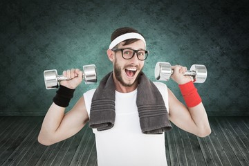 Fototapeta na wymiar Composite image of geeky hipster lifting dumbbells in sportswear