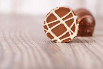 Chocolate truffles on a wooden surface