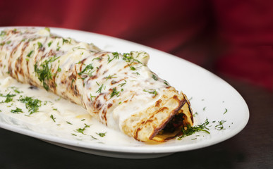 Crepes with ham and cheese close up