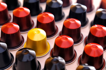 Set of espresso coffee capsules aligned diagonally