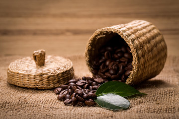 pile of fresh beans and green leaves and spoon in jar