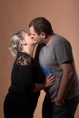 Beautiful xxl woman kissing her husband