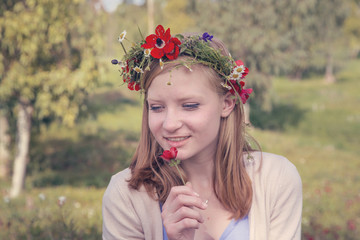 Teen girl on spring meadow - romantic concept