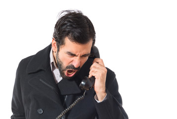Man talking with vintage phone