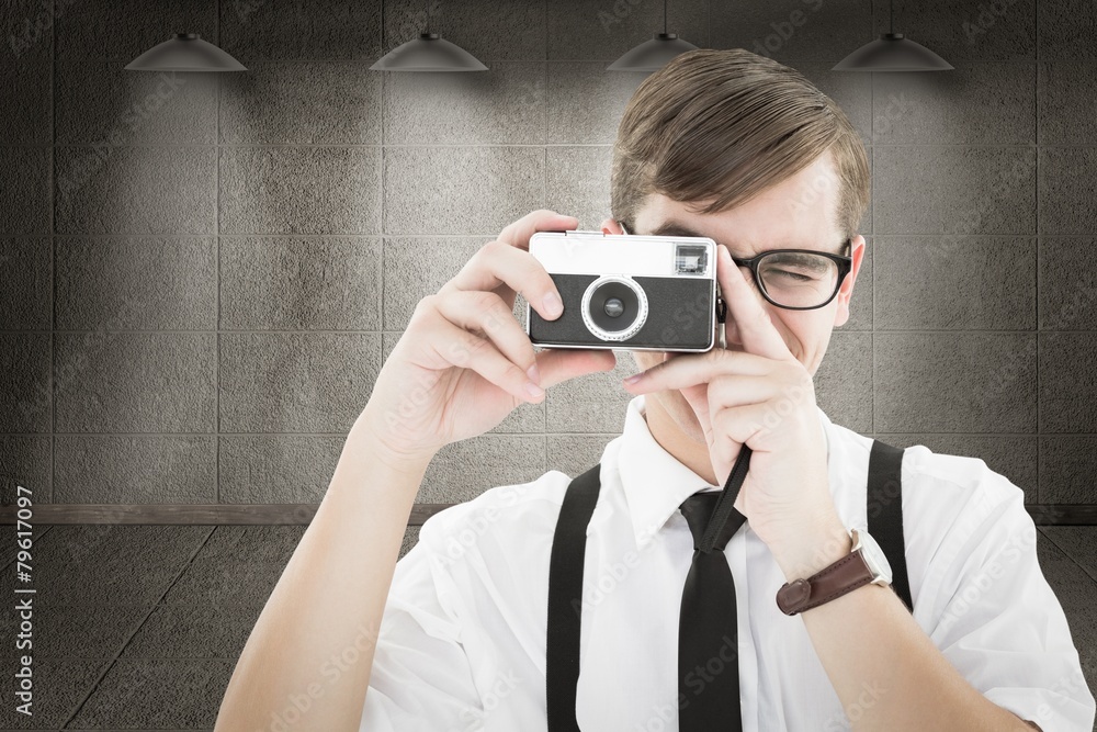 Aufkleber Composite image of geeky hipster holding a retro camera
