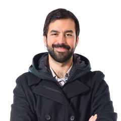 Obraz premium Man with his arms crossed over white background
