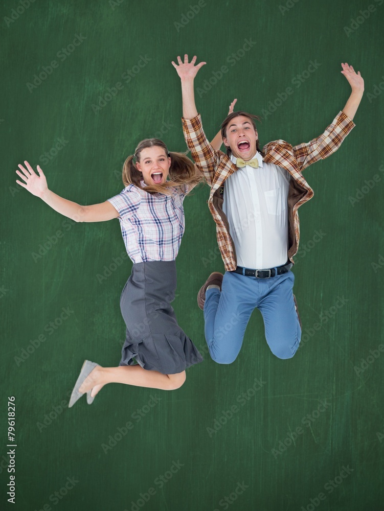 Poster Composite image of geeky hipsters jumping and smiling