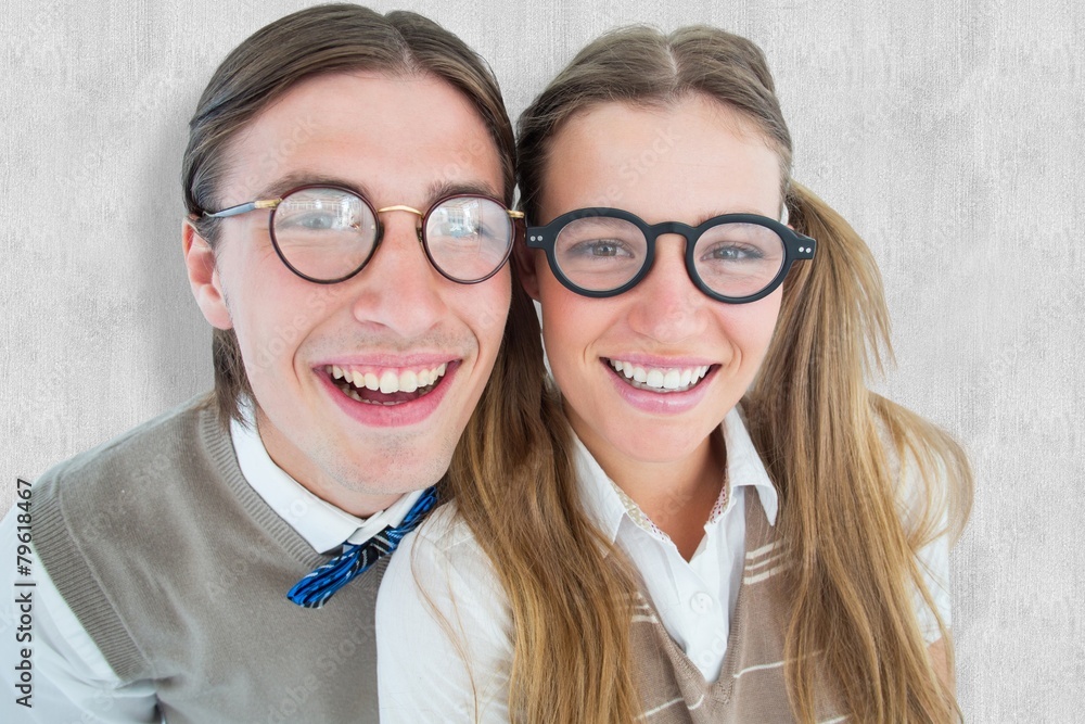 Poster Composite image of geeky hipsters smiling at camera