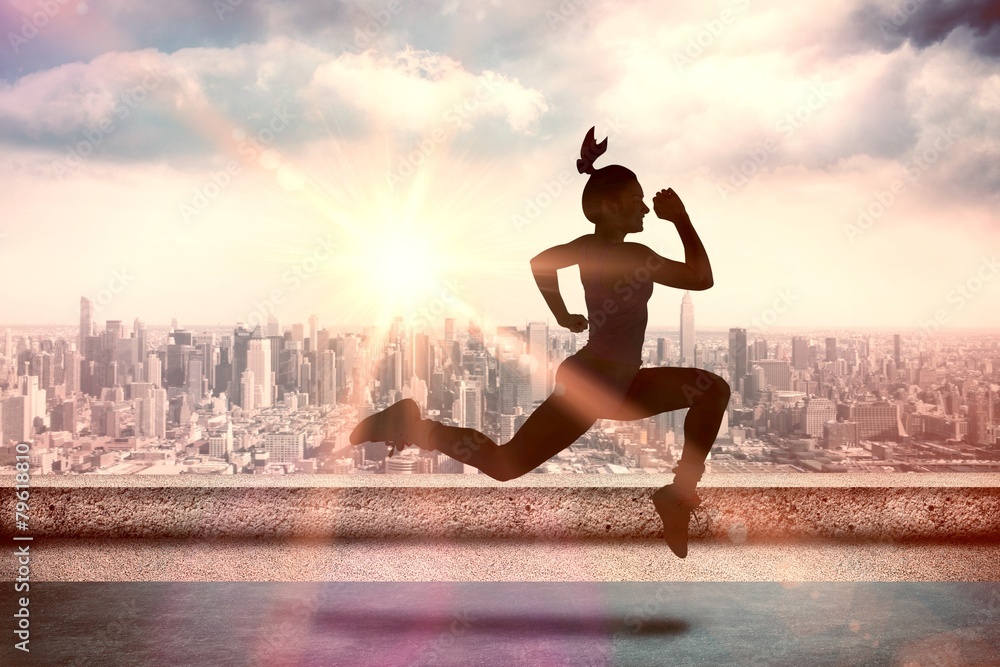 Poster Composite image of fit brunette running and jumping