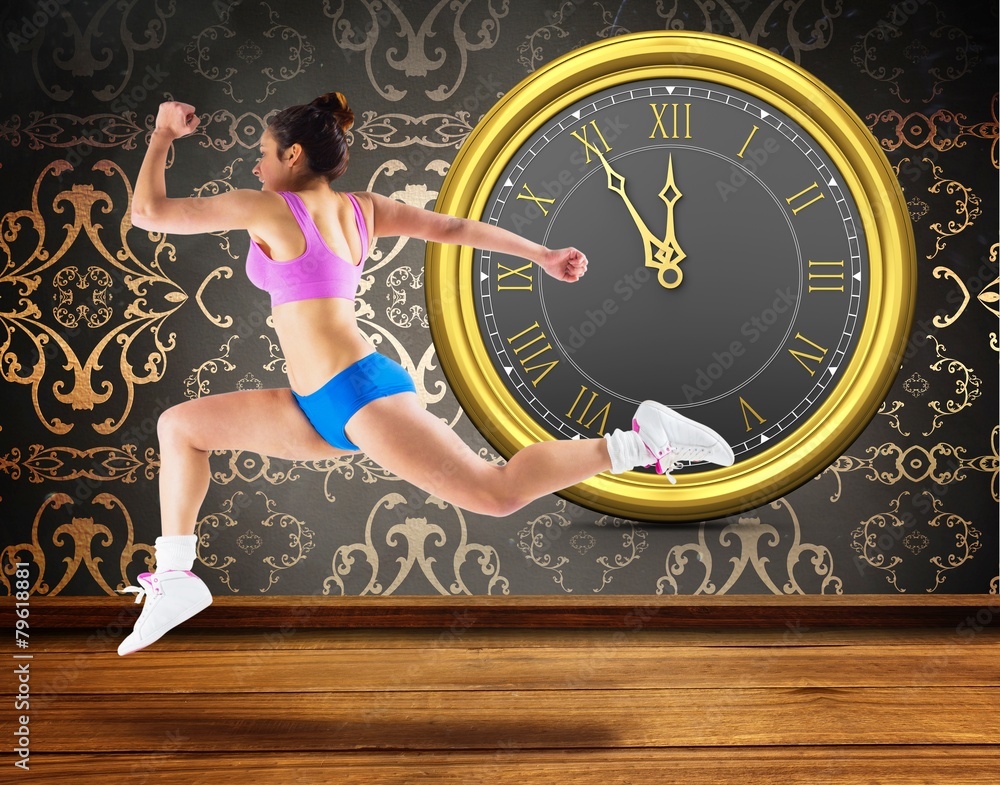 Poster Composite image of fit brunette running and jumping