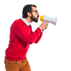 Hipster man shouting by megaphone