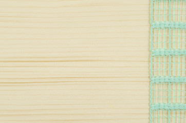 Naklejka premium Frame of green ribbon on wooden table