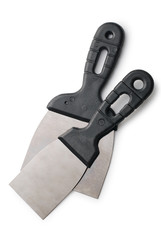 Two metal spatula with a black handle on white background