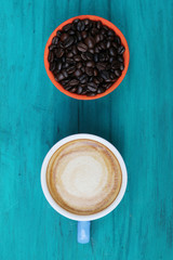 close up top view coffee cup on green wood background