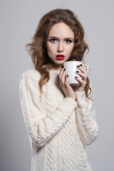 winter girl with cup of tea
