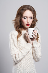 beautiful young woman drinking coffee