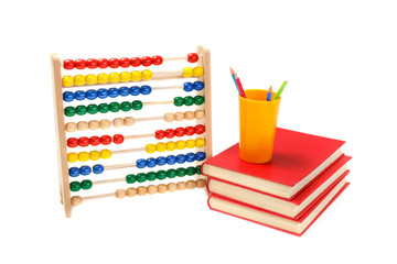 Colorful abacus, books and pencils on white background