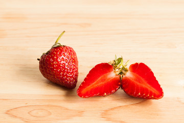 Fresh strawberry on wood.