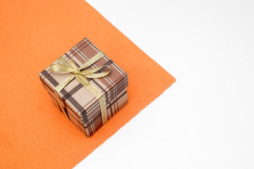 brown gift box with bow on white background