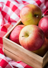 Red apples in a wooden basket