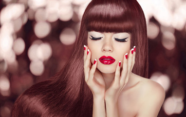 Makeup. Long hair. Beautiful young woman with long wavy hairstyl