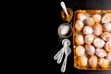 donuts in a glass vase, powdered sugar and honey