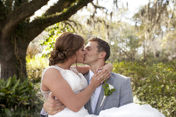 Young newly married couple kissing