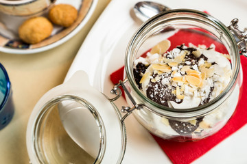 Restourant serving dish - sweet dessert in glass on table