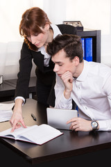 Business man and business woman teamwork in the office.