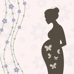 Pregnant woman silhouette with flowers and butterflies