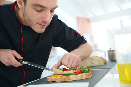 Chef preparing delicatessen disg