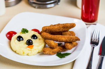 Restourant serving dish for child`s menu - potato puree, stick w
