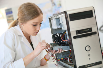 Student girl in technology fixug computer hard drive