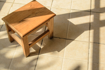 wooden stool in the sunshine