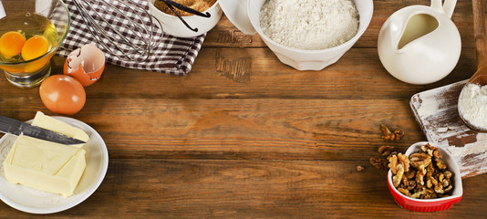 baking ingredients on a wooden background