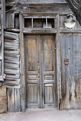 Obsolete wooden door of very old house in Astrakhan, Russia