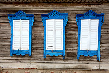 Three tribal Russian style wooden windows in Astrakhan, Russia