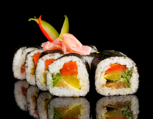 Sushi pieces on black background