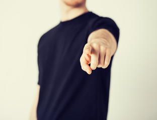man pointing his finger at you