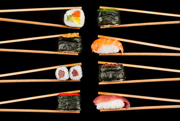 Sushi pieces in chopsticks