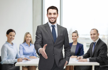 businessman with open hand ready for handshake