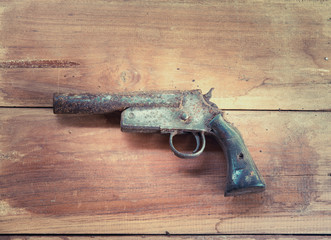 Hand shot gun , old shot gun on the wooden board
