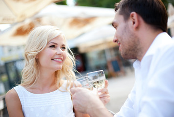 couple drinking wine in cafe