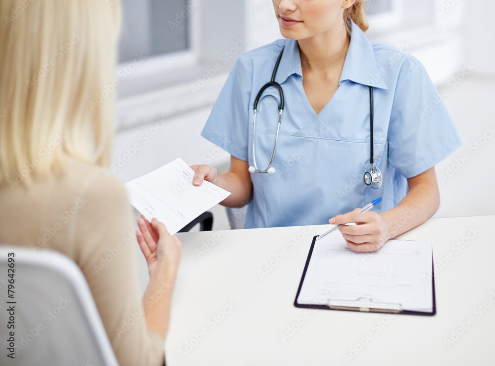 Wall mural close up of doctor and woman meeting at hospital