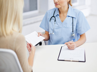 close up of doctor and woman meeting at hospital