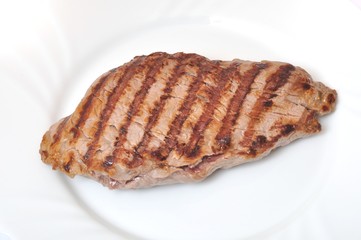 Grilled beef steak on plate