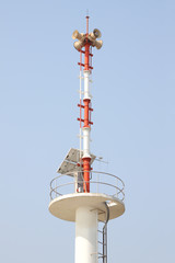 Fototapeta na wymiar Vertical warning tower tsunami on blue sky.